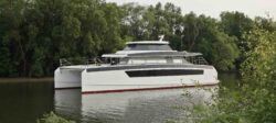 Large white luxury catamaran on a river