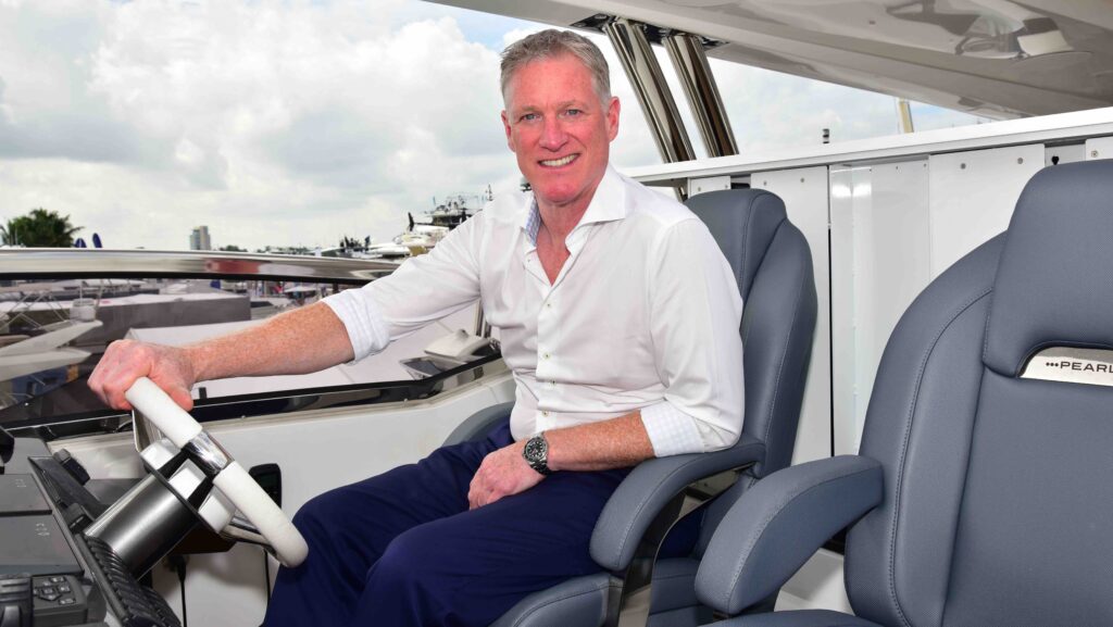 Iain Smallridge MD Pearl Yachts sat behind a steering console on a boat and says that his company will build bigger boats in response to demand