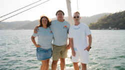 Image of two men and one woman from BOATSCRIBE and EOS Yacht Charter on a sailboat
