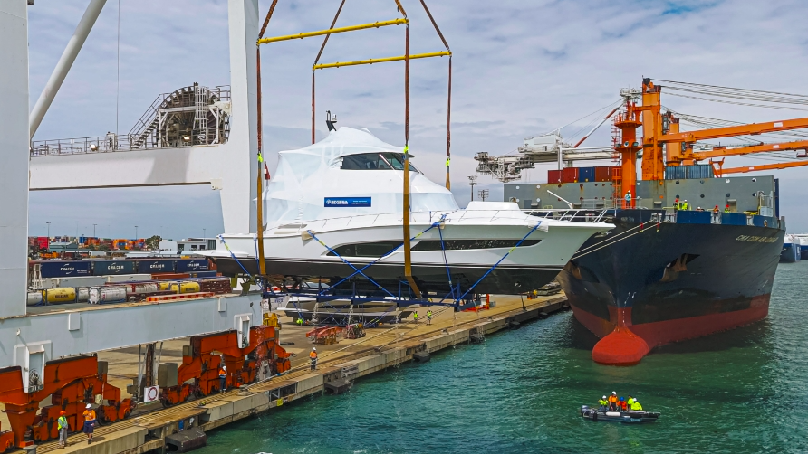 Riviera Marine export to FLIBS - boat in cradle being loaded onto ship