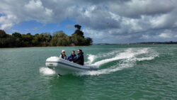 image of inflatable rib with three people in cruising
