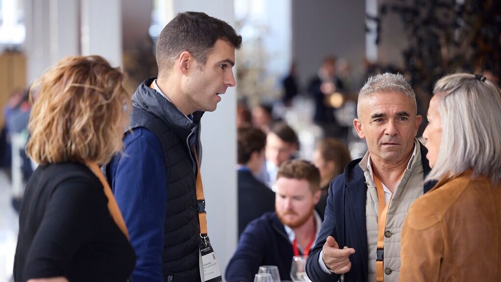 four business people networking