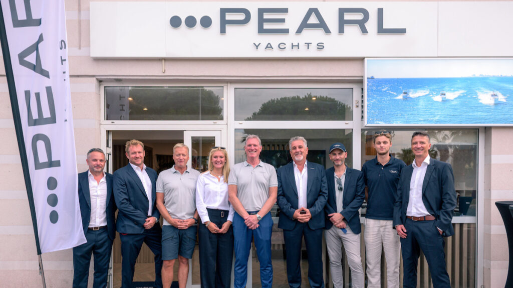 Group of business people standing outside Pearl Yachts office