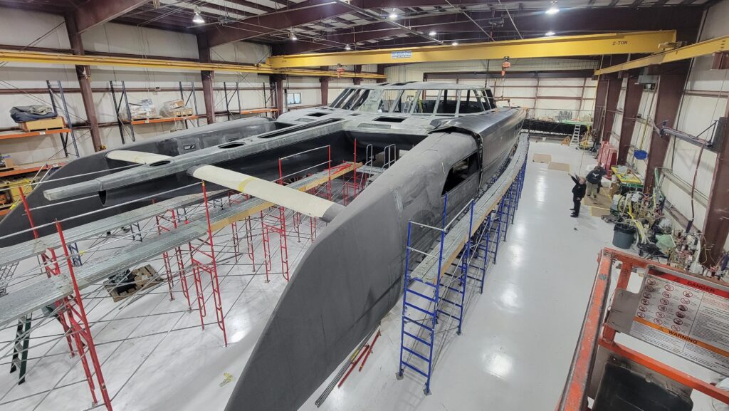 One of the real estate listings for the Daedalus factory shows this enormous unfinished catamaran.