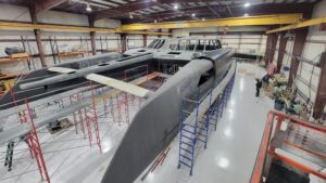 One of the real estate listings for the Daedalus factory shows this enormous unfinished catamaran.