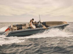 Williams Marine Group boat on the water with two people inside.