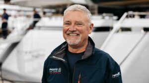 Man in boat jacket smiling at camera