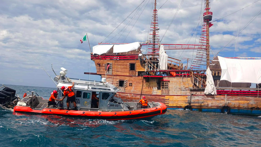 Marigalante, a replica of Christopher Columbus’ famed galleon, Image courtesy of Civil Protection and being viewed by emergency services craft before sinking