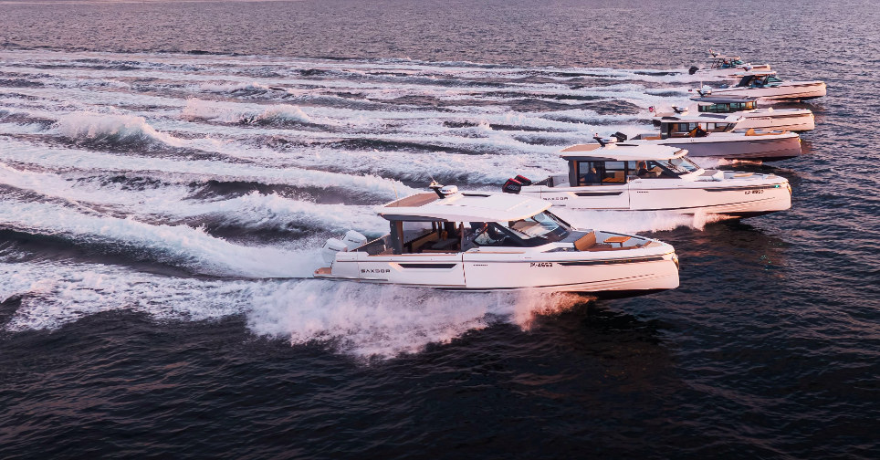 A line of white Saxdor boats to show company is moving into Canada