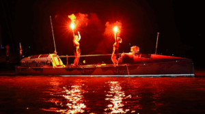 Jess Rowe and Miriam Payne let off flares to celebrate rowing the Pacific