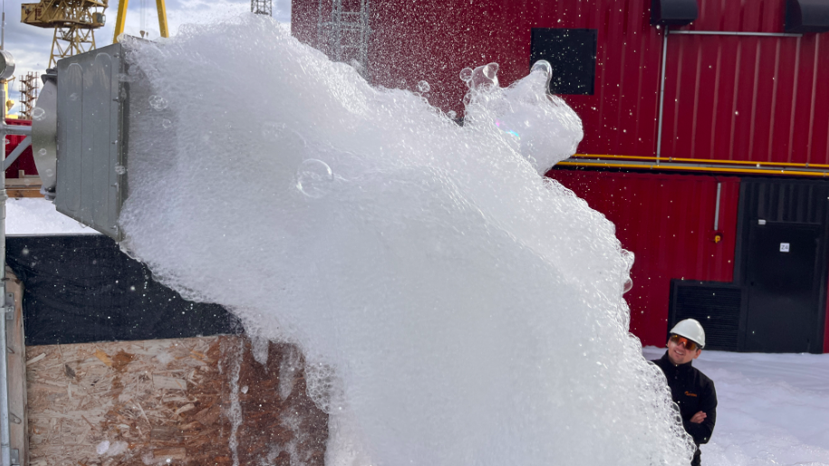 foam billows down onto a ship's deck as Survitec unveils next-generation high expansion foam system