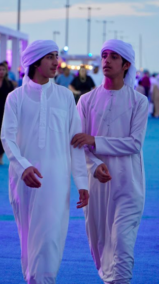 Two men walk on docks at boat show