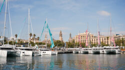 Boats in a marina with Barcelona backdrop