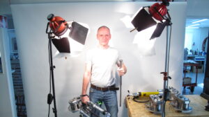 Man showcasing Wireteknik A210 and A360 swaging machines