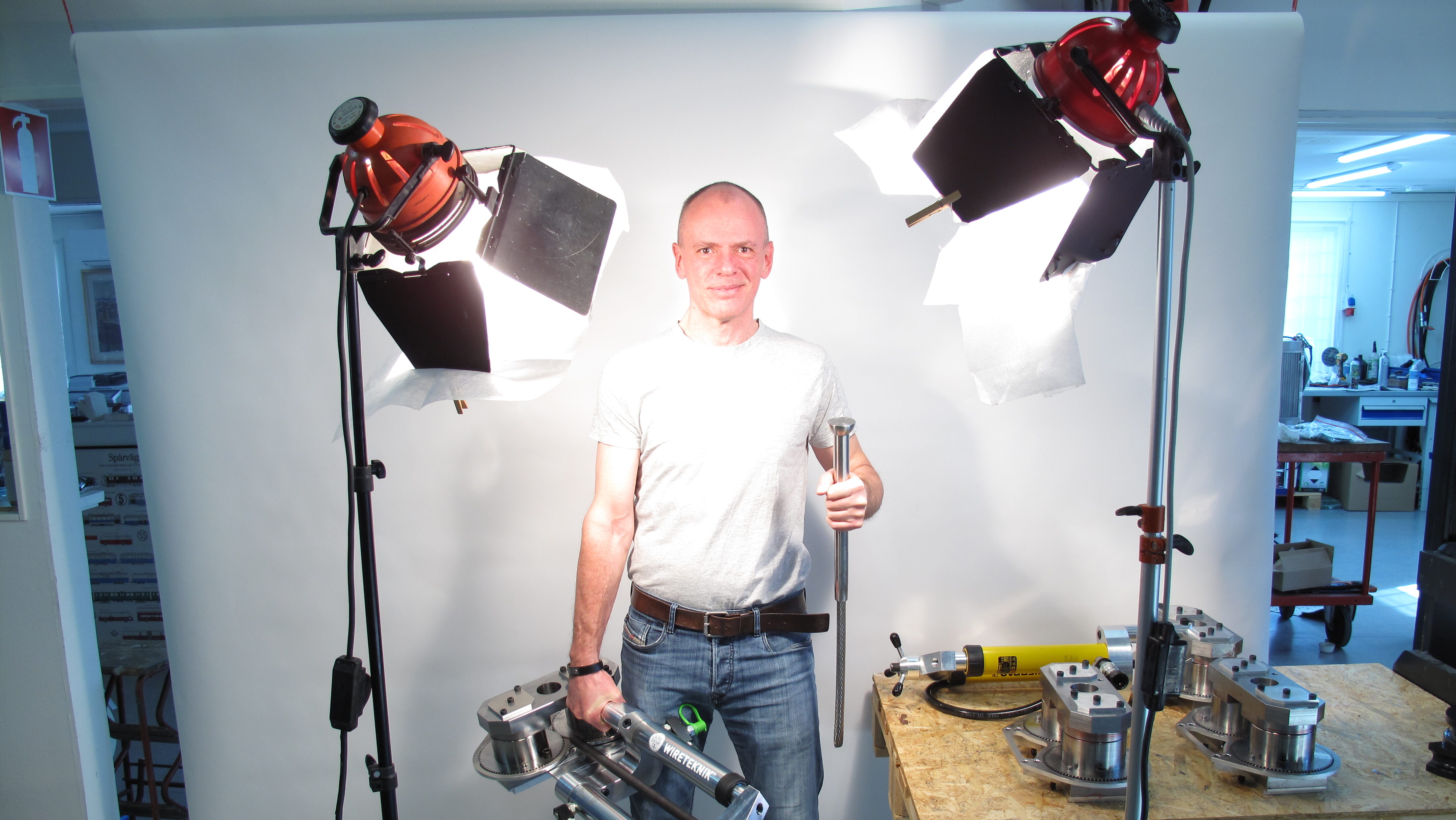Man showcasing Wireteknik A210 and A360 swaging machines