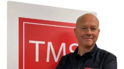 David Mossman against TMS logo background