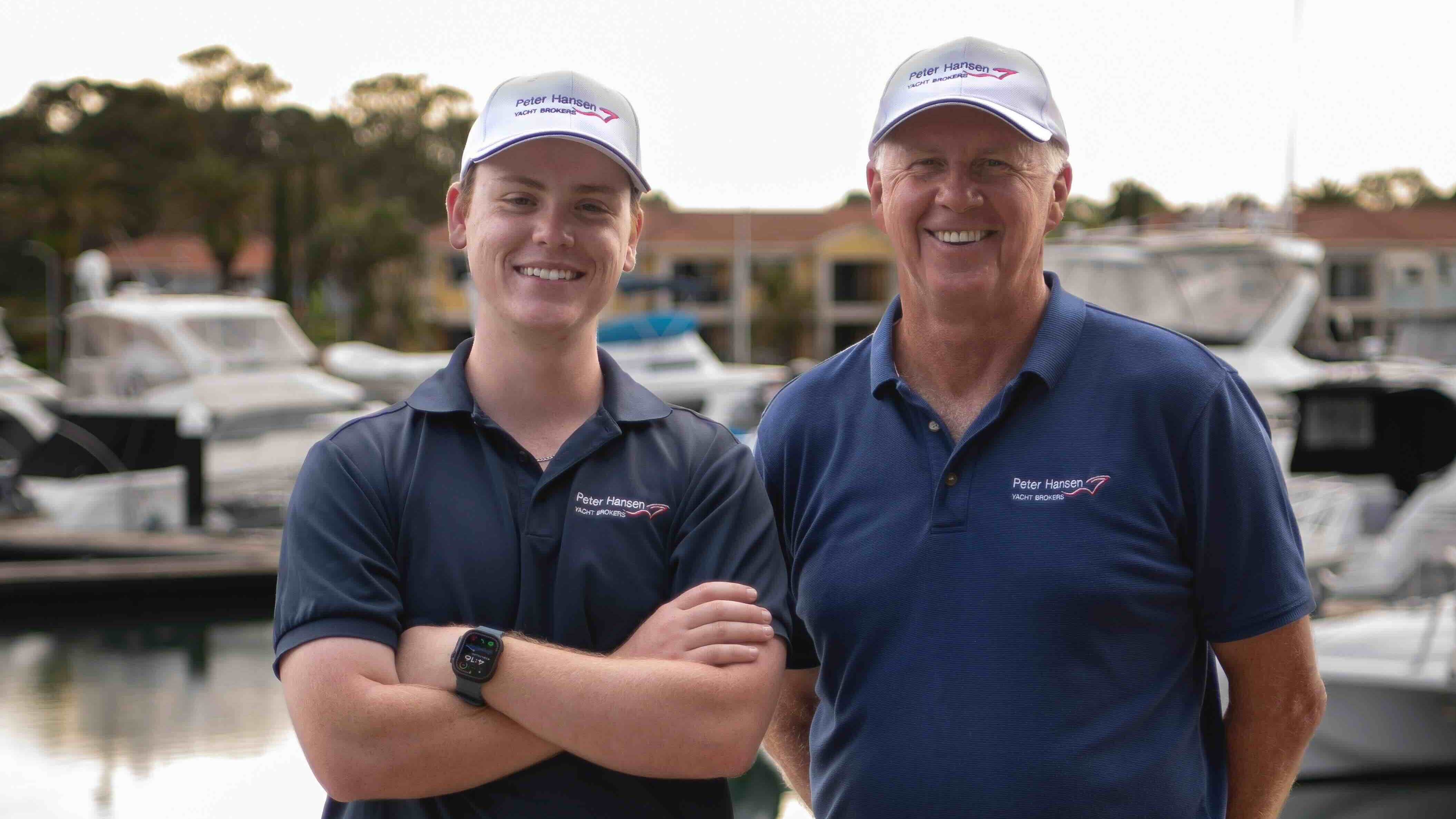 two man in caps at marina