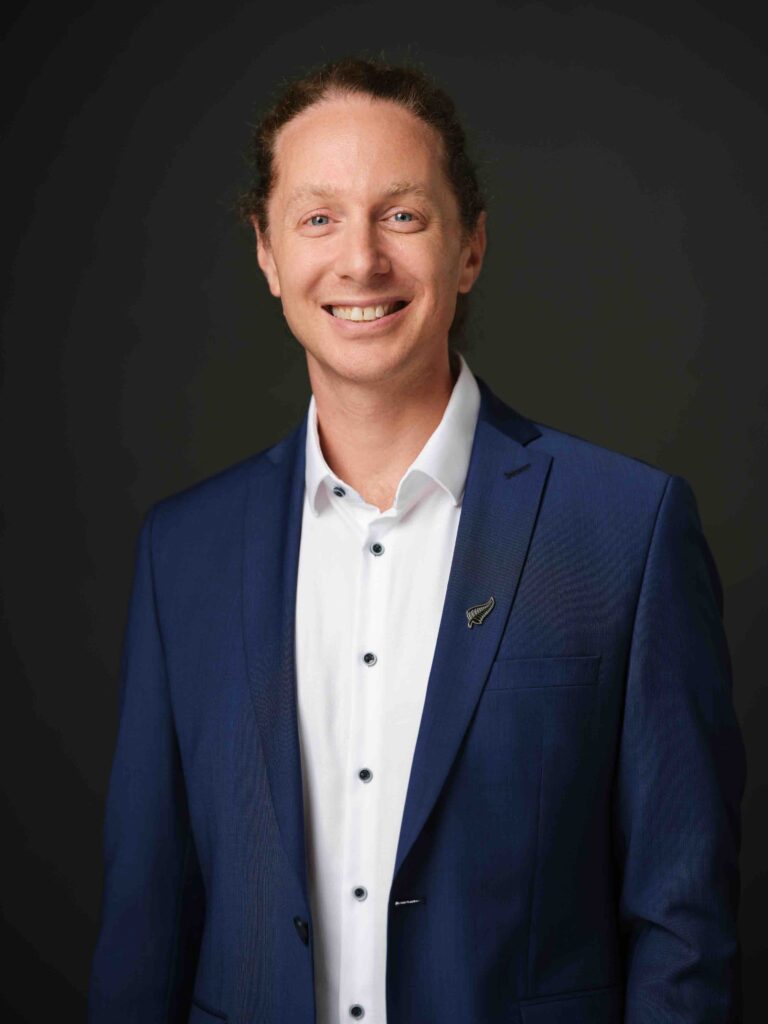 man in blue suit smiling