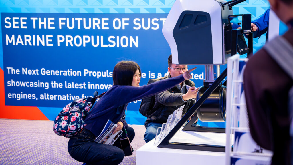 A person at Metstrade examines a product