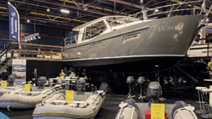 grey luxury motor boat on exhibition stand at boat show