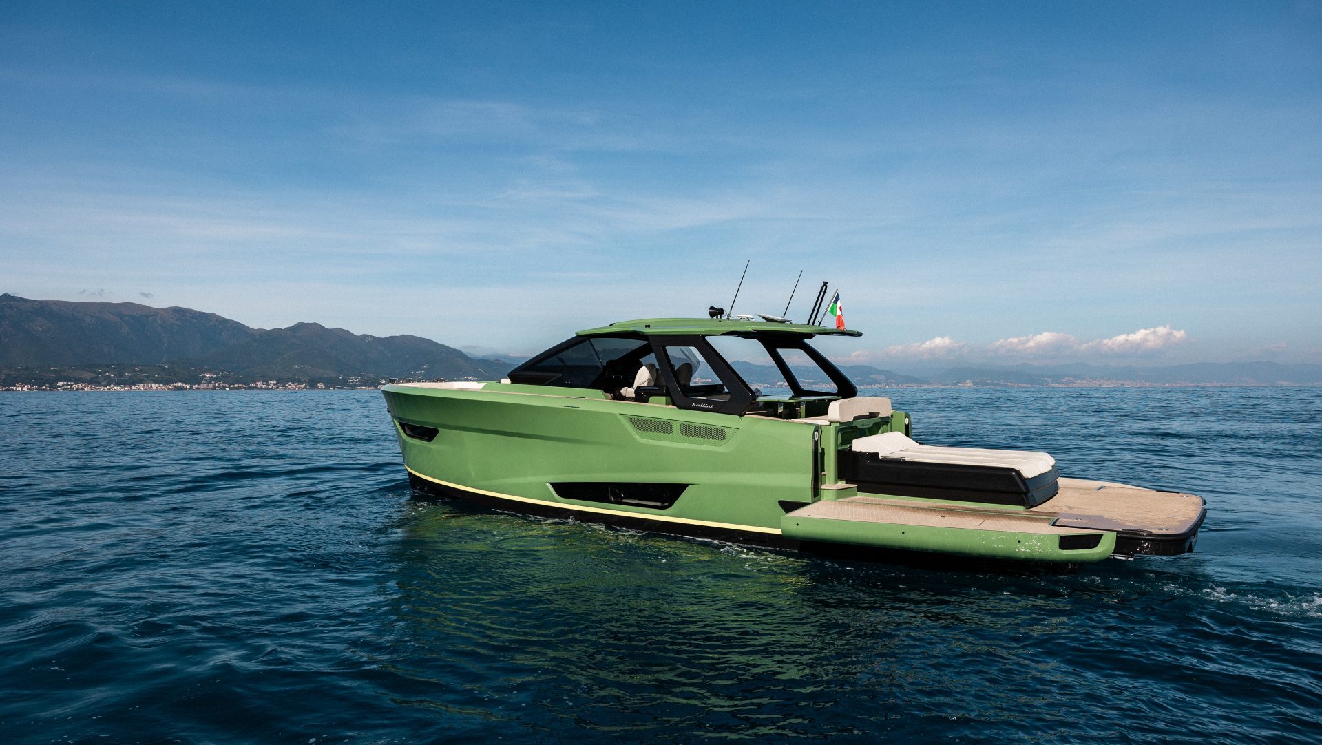 Side view of green Bellini Astor yacht