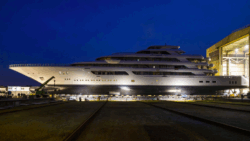 night shot of Boardwalk by Lürssen coming out of shed
