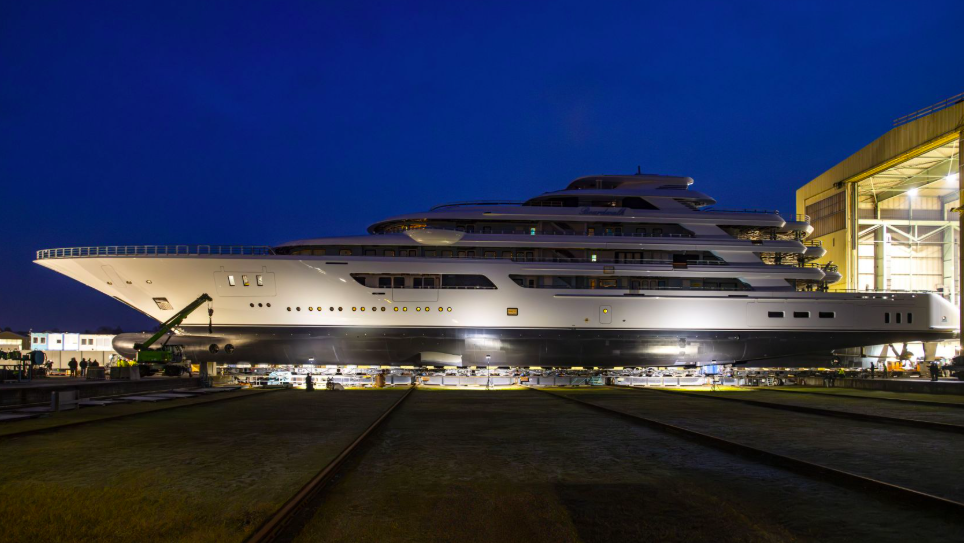 night shot of Boardwalk by Lürssen coming out of shed