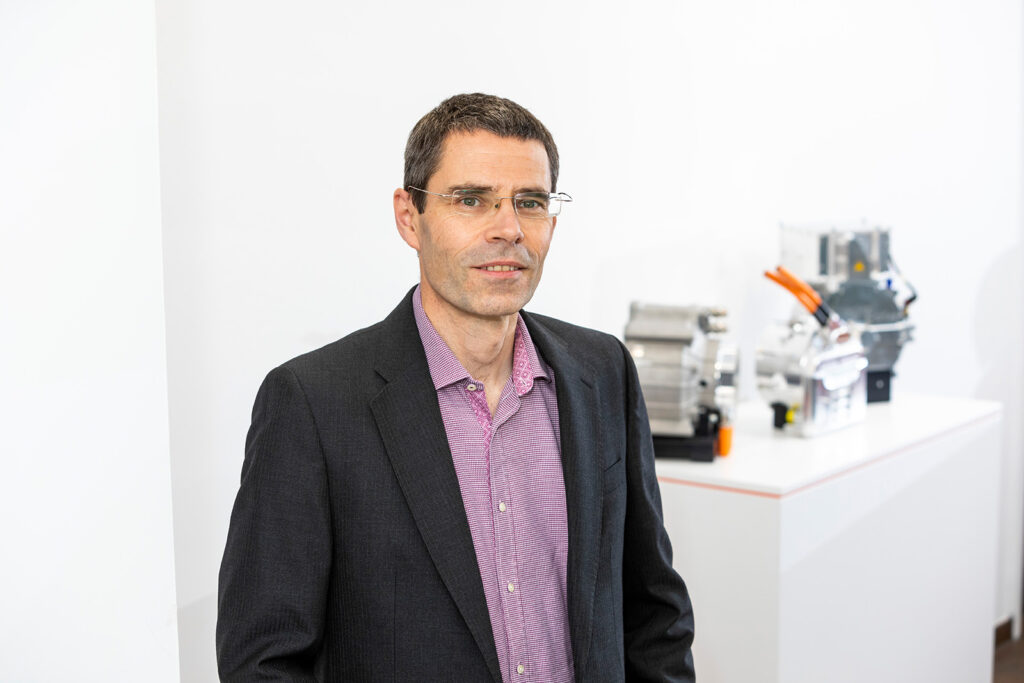 man with glasses in white office