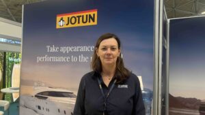 woman in front of Jotun exhibition stand