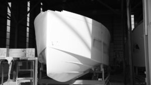 A Manari Yacht poking its bow out the shed