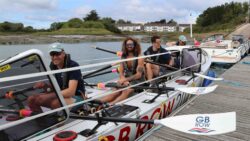 rowers in large row boat by pontoon for GB Row Challenge