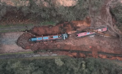 canal boats in muddy crater
