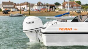 White Terhi Boat hull with Yamaha outboard installed