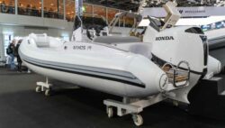 White Naxos 19 RIB boat at indoor boat show