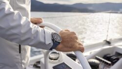 Garmin Quatix 8 Pro watch on a wrist at helm