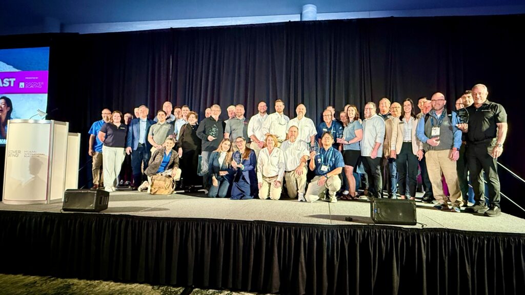 Group of people on stage at industry marine awards