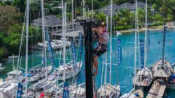 crew working on Oyster Yacht prior to world rally - mast