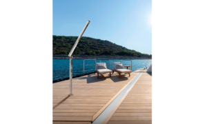 A rainwash shower on a boat's deck with sun loungers in the background