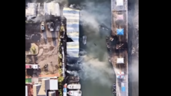 aerial view ofsmoking cinders of Marker 37 marina buildings