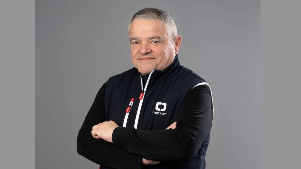 Studio shot of man in dark sailing jacket with arms crossed