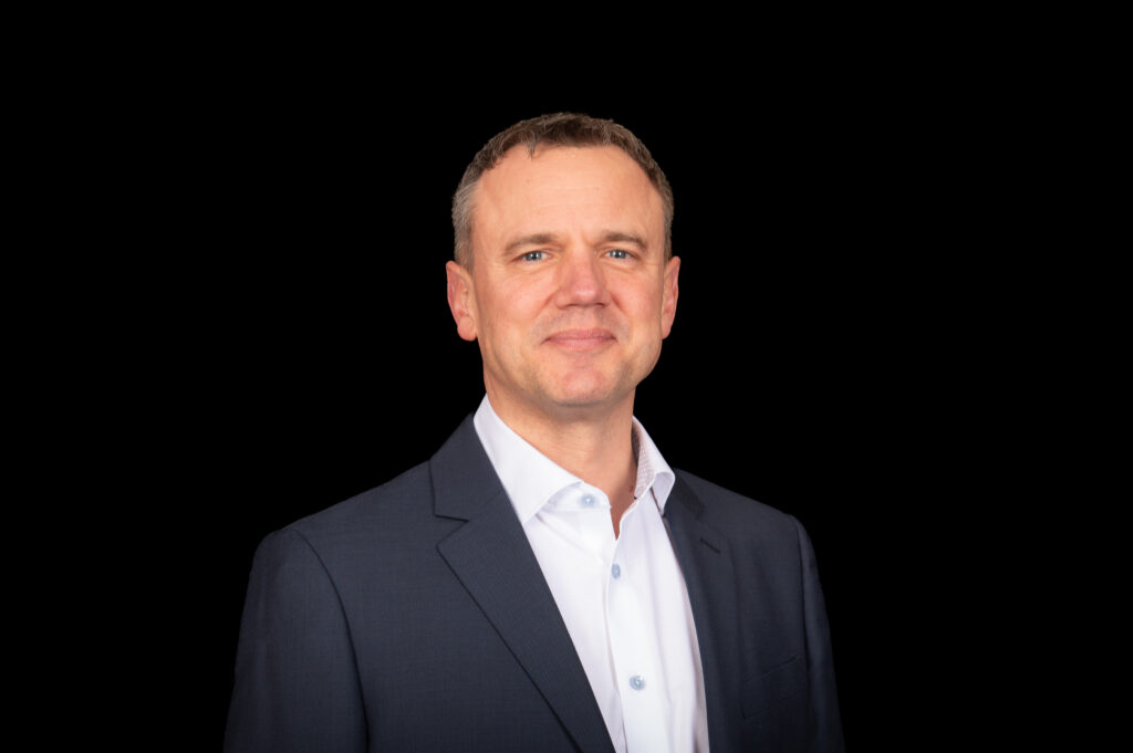 Head photo of man in suit and white shirt