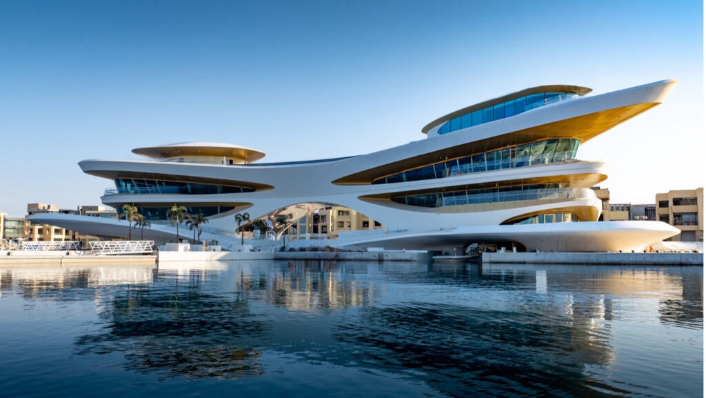Amaalya Yacht Club seen from water - a futuristic looking building