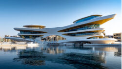 Amaalya Yacht Club seen from water - a futuristic looking building