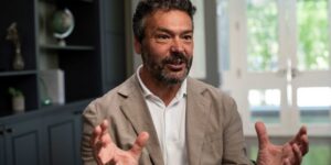 man in jacket talking