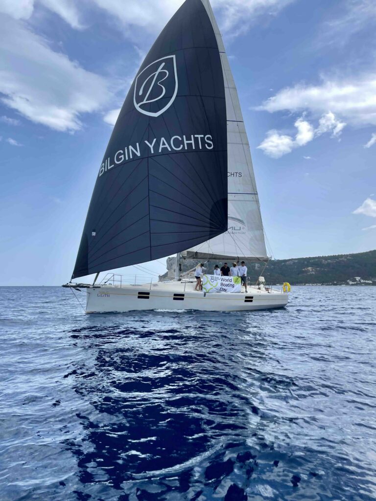 Bilgin Sail Yacht with people onboard waving 
