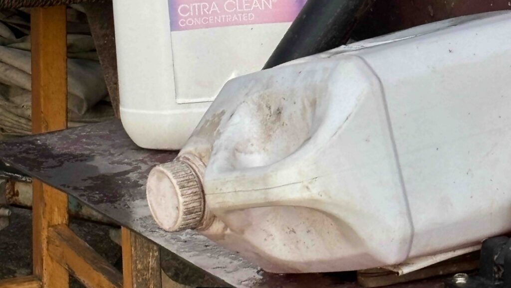A bleach bottle in a marina