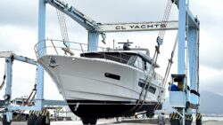 Large motorboat in shipyard hoist