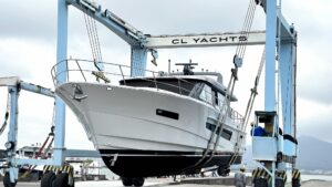 Large motorboat in shipyard hoist