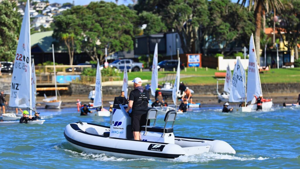 electric boat being used at sailing school regatta
