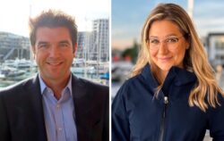 business man and woman smiling